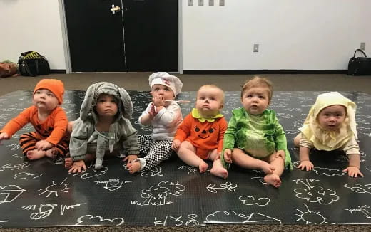 a group of children sitting on the floor