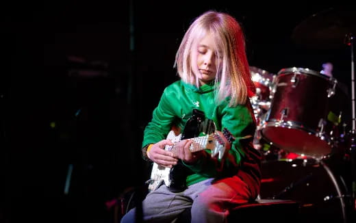 a person playing a guitar