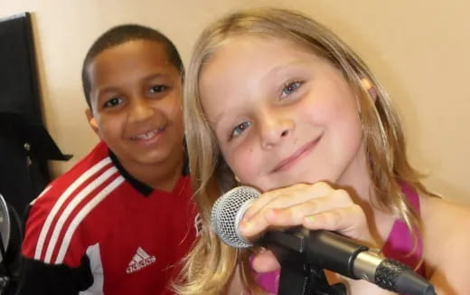 a girl and boy smiling