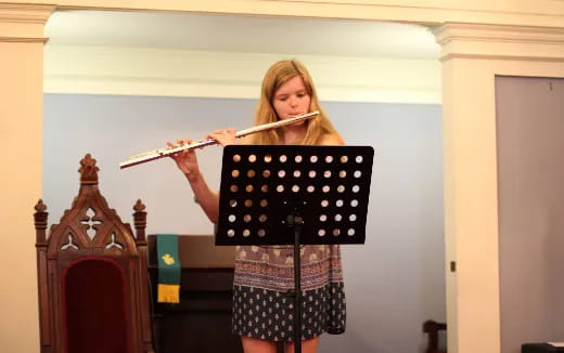 a woman playing a flute