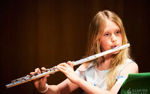 a girl playing a violin