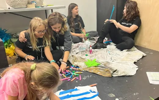 a group of women painting