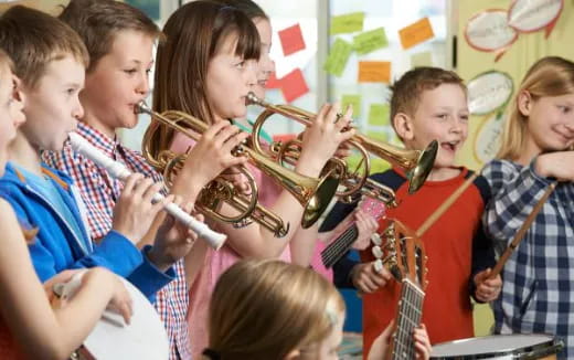 a group of kids playing instruments