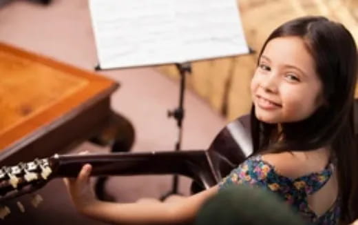 a person holding a violin