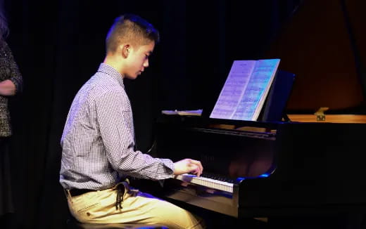 a man playing a piano