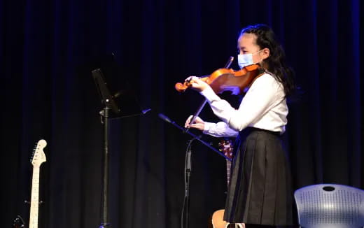 a person playing a violin