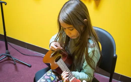 a girl playing a violin
