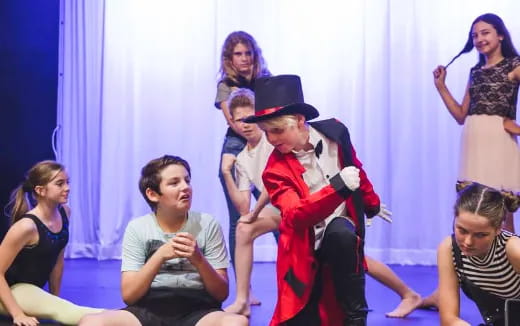 a woman in a garment dancing with a group of people