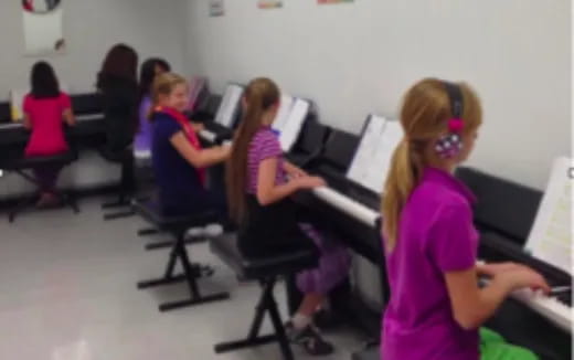 a group of kids playing musical instruments