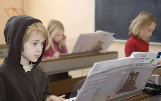 a woman looking at a laptop