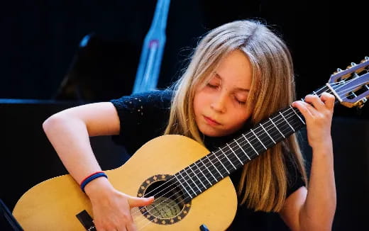 a person playing a guitar