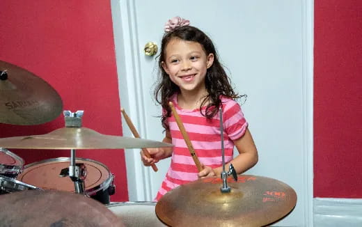 a girl playing drums