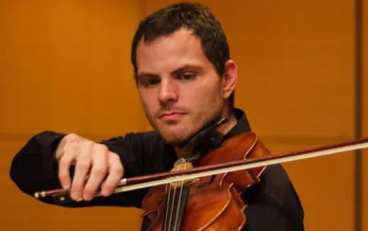 a man playing a violin