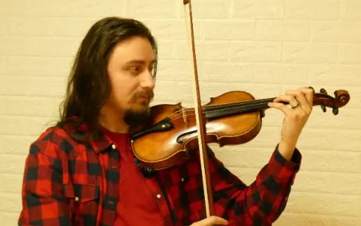 a person playing a violin