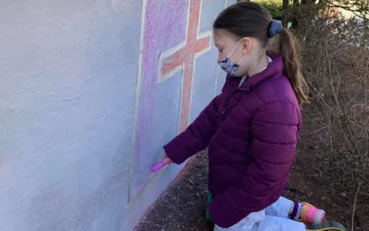 a woman sitting on a wall