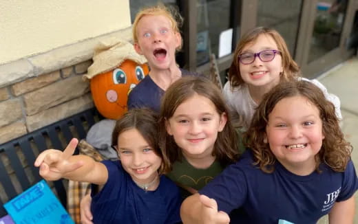 a group of kids posing for a photo