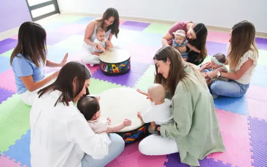 a group of people sitting on the floor