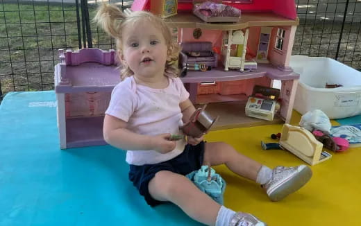 a child sitting on a toy