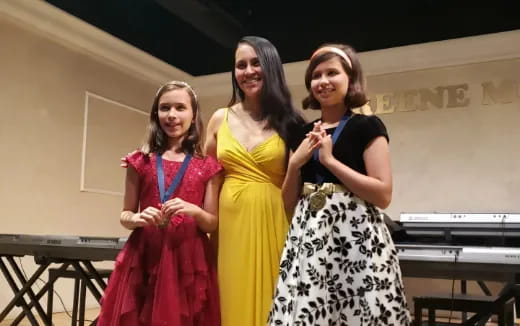a group of women in dresses