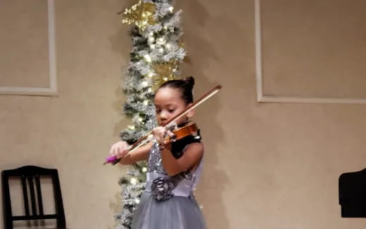 a person playing a violin