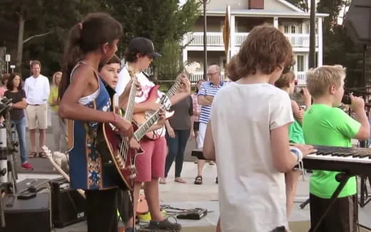 a group of people playing instruments