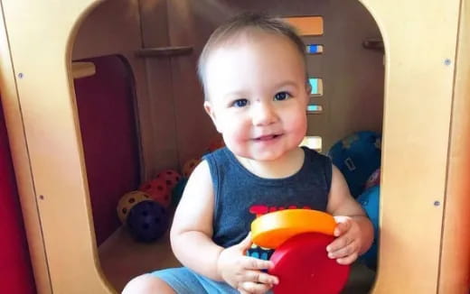 a baby sitting in a chair