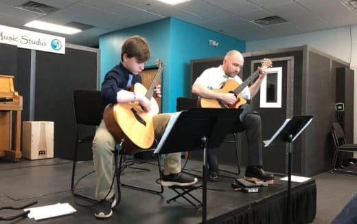 a group of men playing guitars