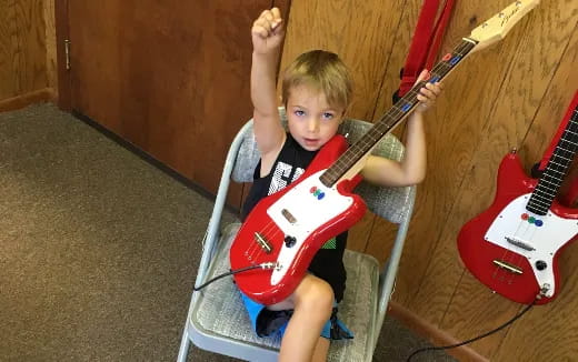 a child playing a violin