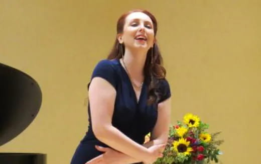 a woman holding flowers