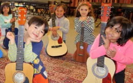 a group of children playing instruments