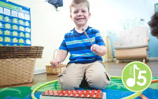 a boy sitting on a table