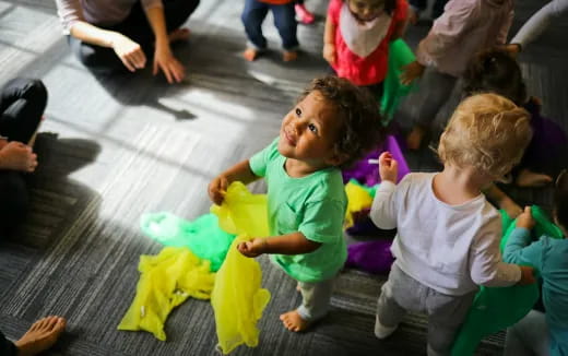 a group of children playing with a toy