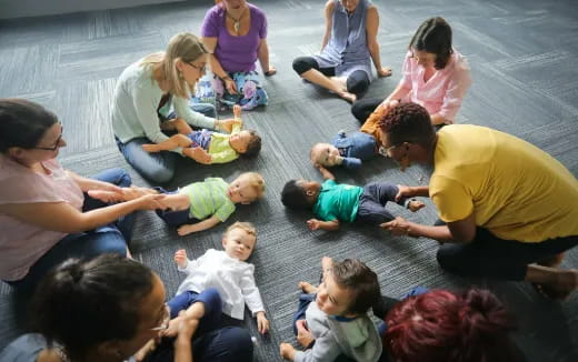 a group of people sitting on the floor