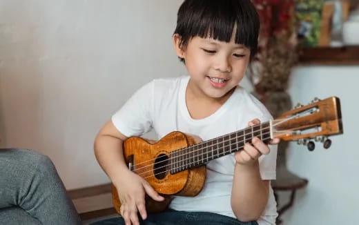 a boy playing a violin