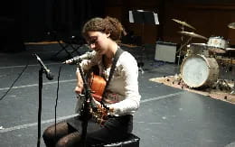 a man playing a guitar