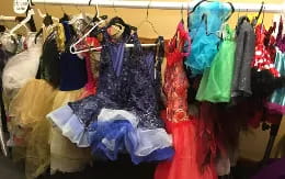 a group of clothes in a store