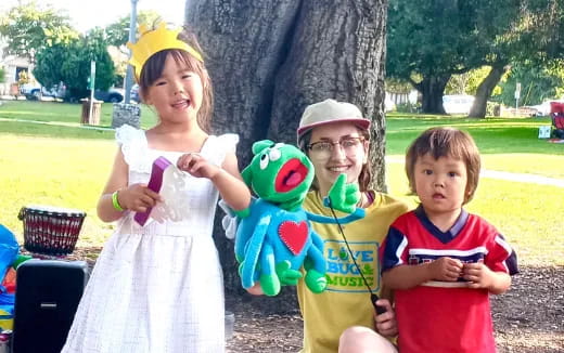 a group of children holding toys
