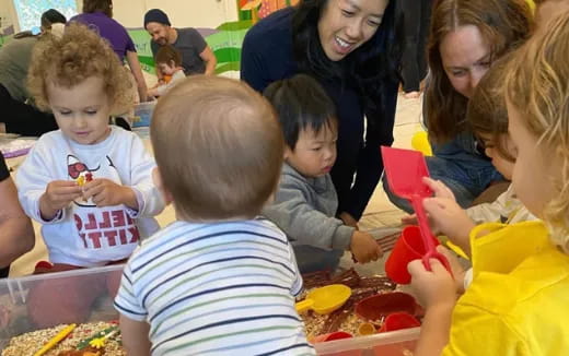 a group of children playing with toys