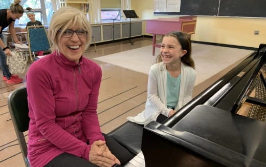 a person and a girl smiling