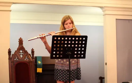 a woman playing a flute