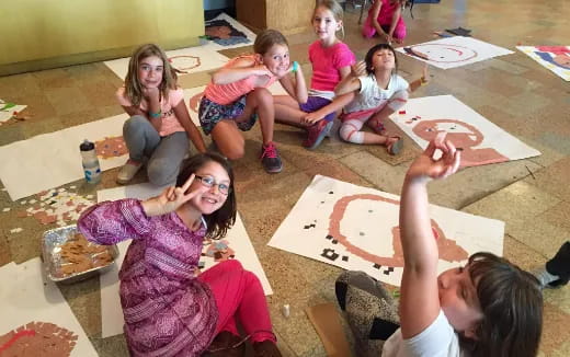 a group of children sitting on the floor