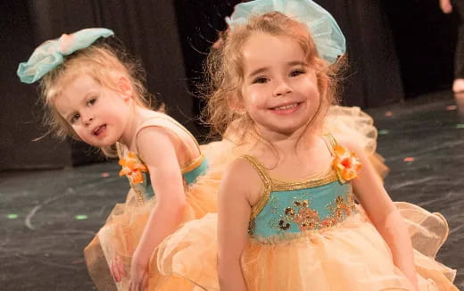 two girls in dresses