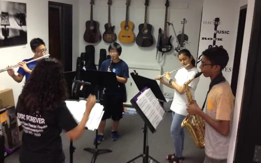 a group of people playing instruments