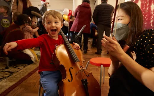 a boy playing a violin