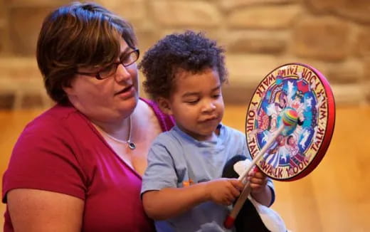 a person and a child painting