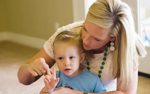 a person holding a baby