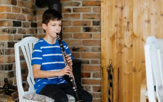 a boy playing a violin