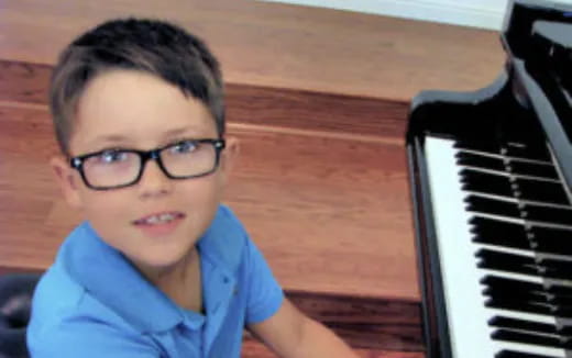 a boy wearing glasses