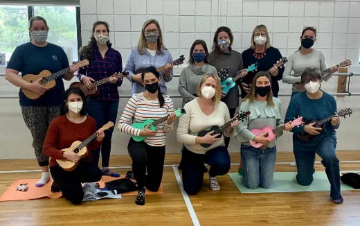 a group of people holding guitars