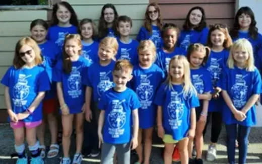 a group of children posing for a photo